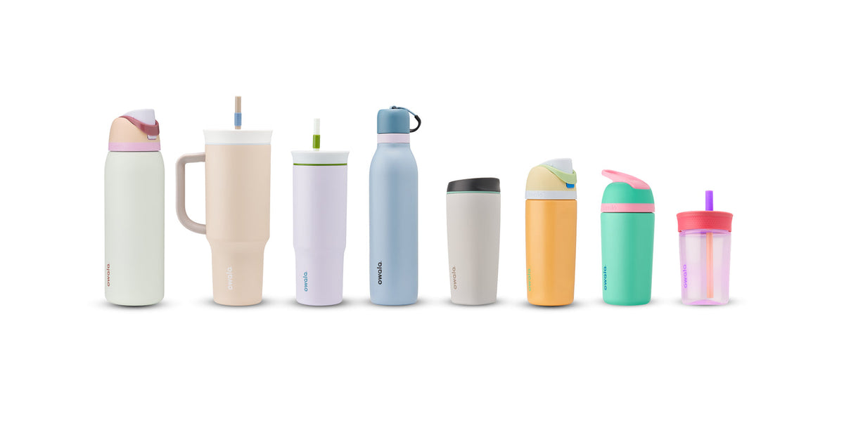 Several stainless steel water bottles and tumblers lined up next to each other.