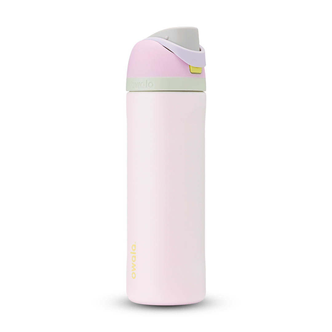 FreeSip 24oz in Candy Coated; soft pink body with pink flip cap, lavender carry loop, sage green accent band on the lid, and yellow push-button